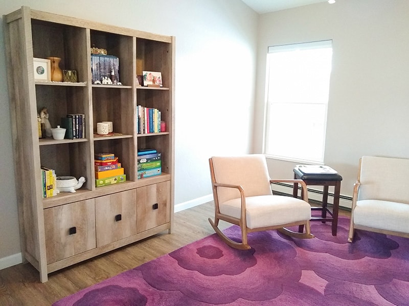 Sitting room with large decorated bookcase