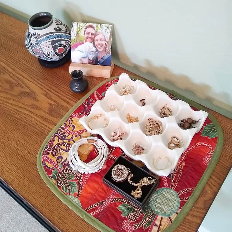 Table with tray of jewelry