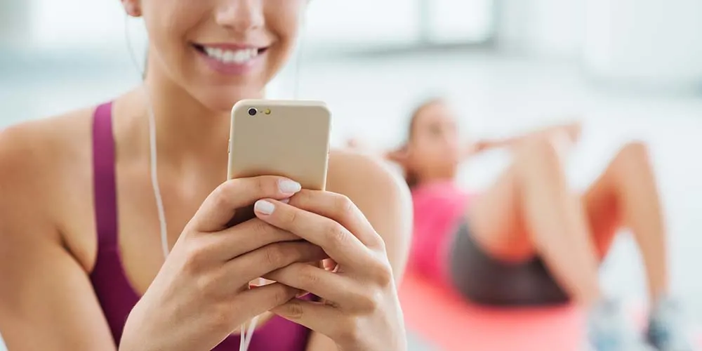 woman smiling at the gym while working out