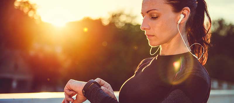 woman using fitness tracker