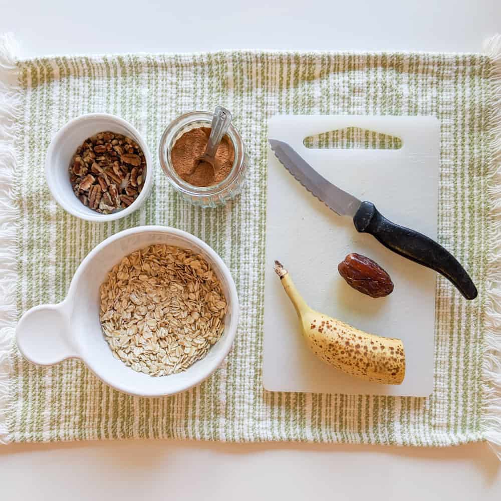 Making Muesli: Oats, pecans, banana, date, and cinnamon. 