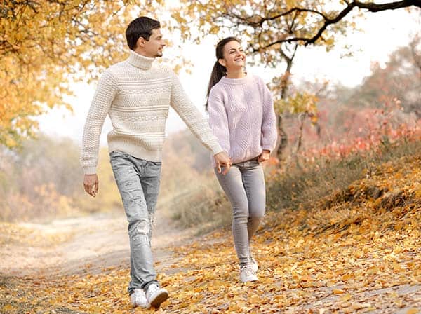 couple walking in the forest