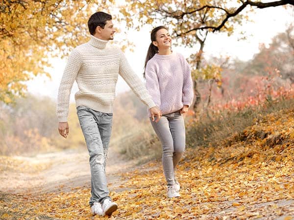 couple walking in the forest