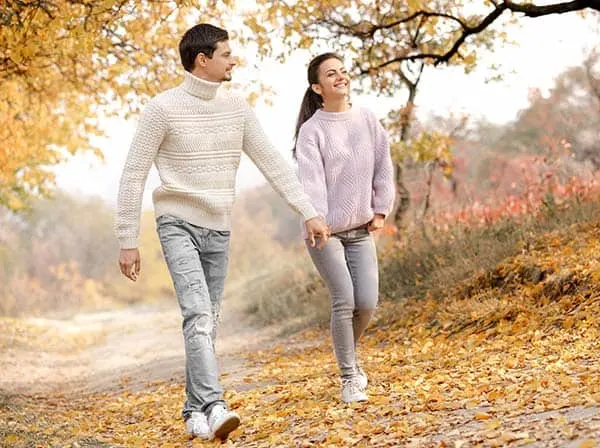 couple walking in the forest