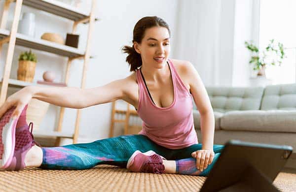 woman doing yoga at home