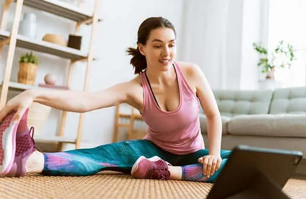 woman stretching at home