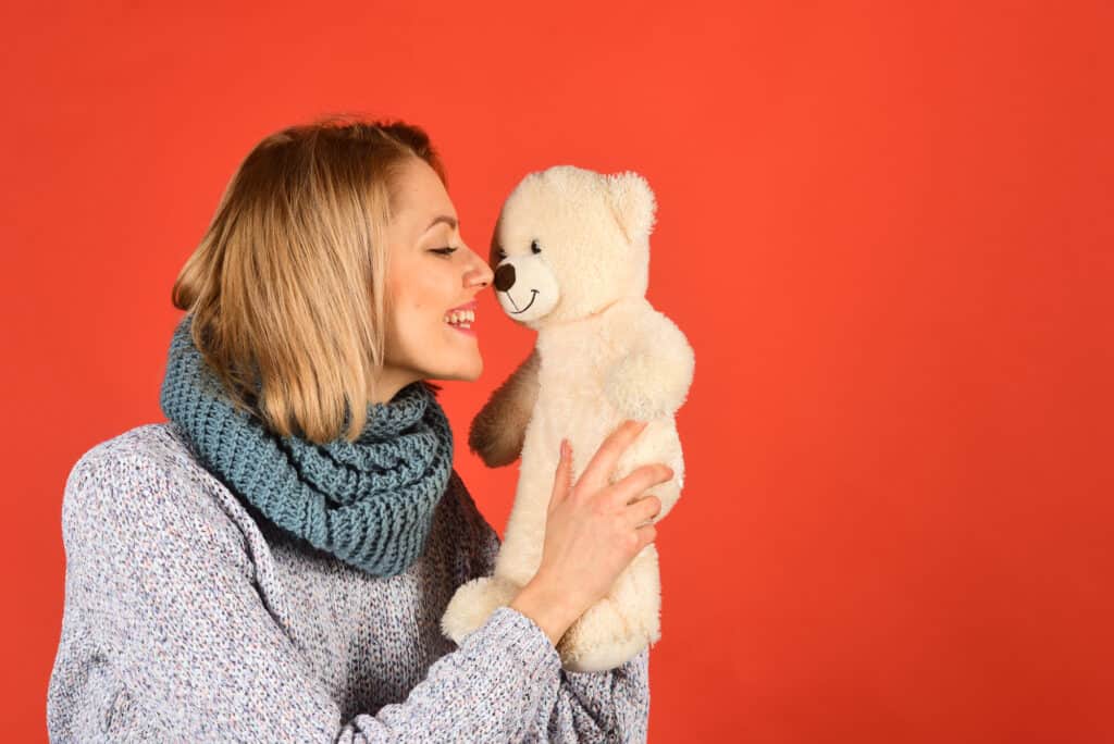 Woman with lovable teddy bear