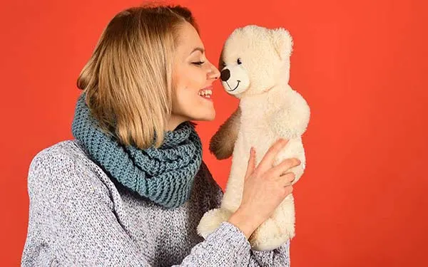 Woman holding a teddy bear