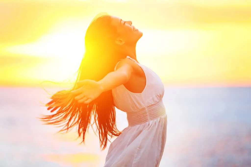 happy woman enjoying sunset