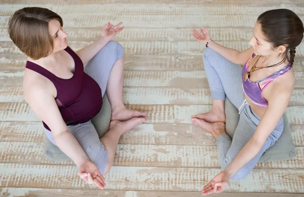 two women meditating