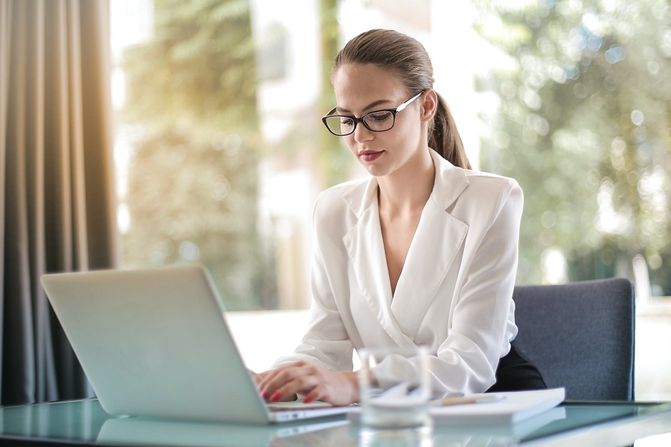 woman working at the computer on her career goals