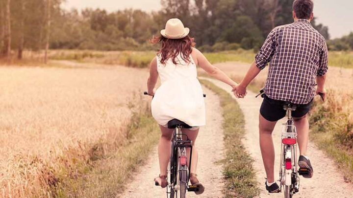 couple on a bike in countryside