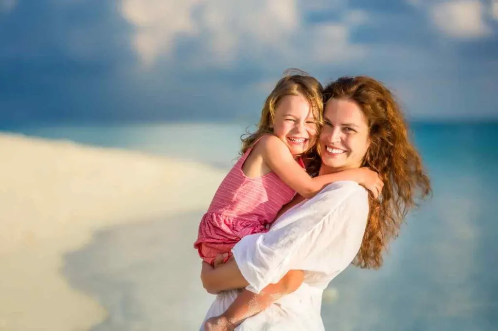 mom and daughter on the beach