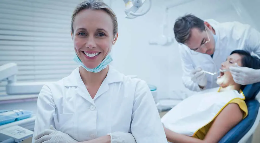 dental hygienist with dentist