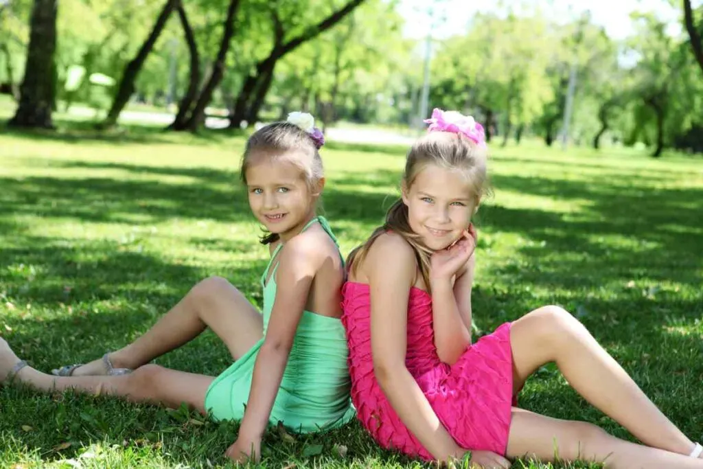 2 girls with bright dresses at the park