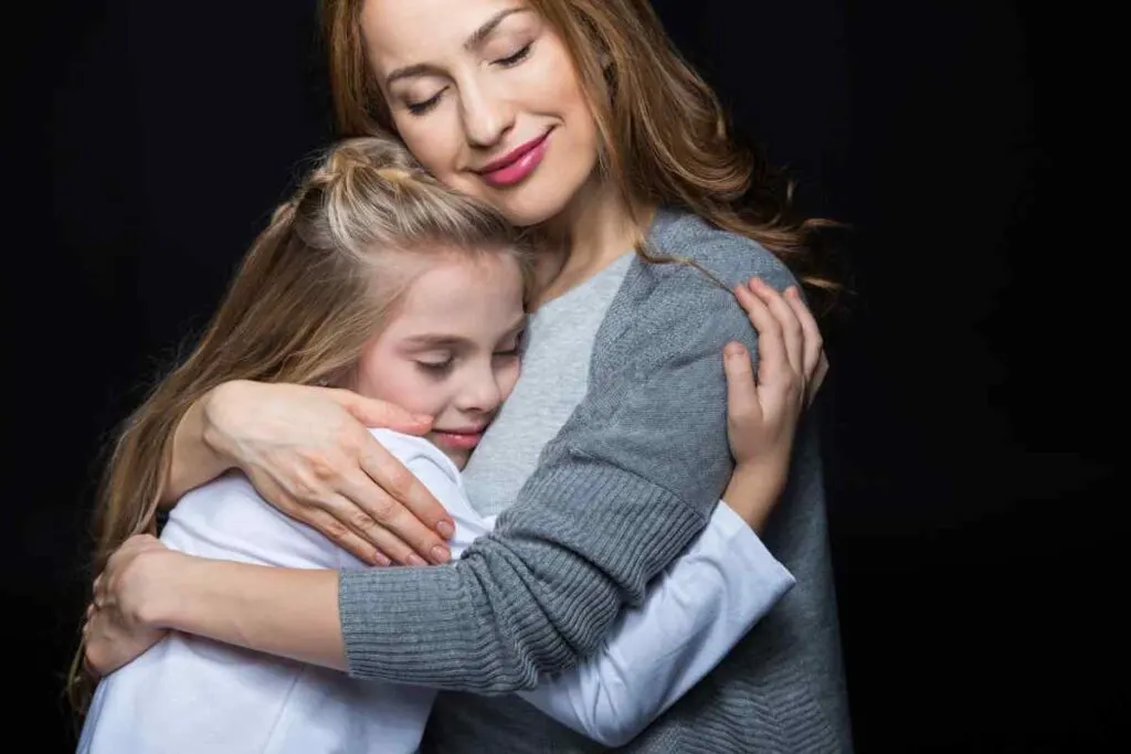 mother and girl hugging