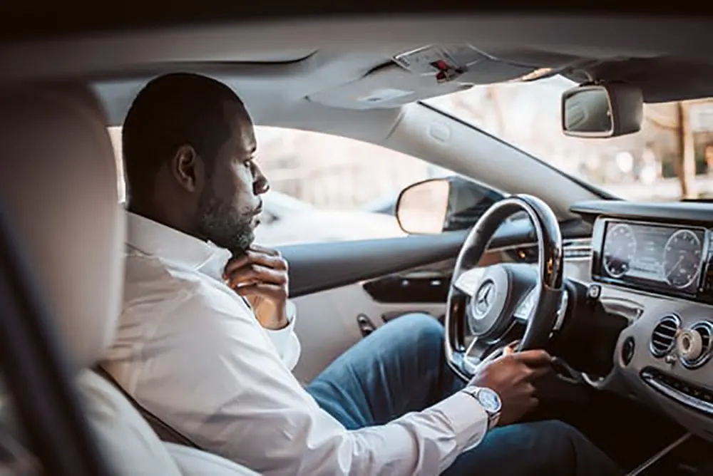 man in car