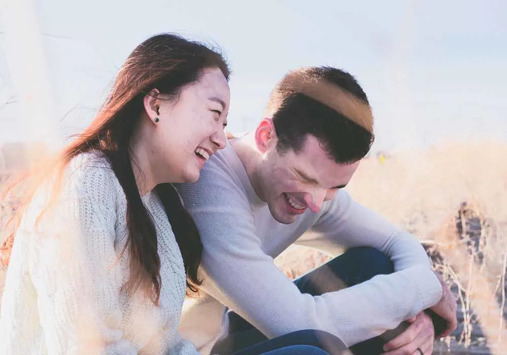 couple laughing together and having a good time