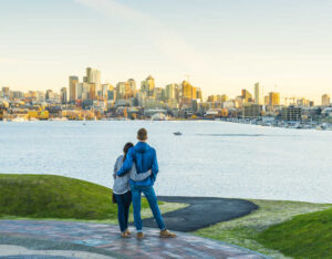 Dating in seattle: a couple in gasworks park admires the seattle skyline together
