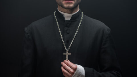 pictures of a priest with a cross