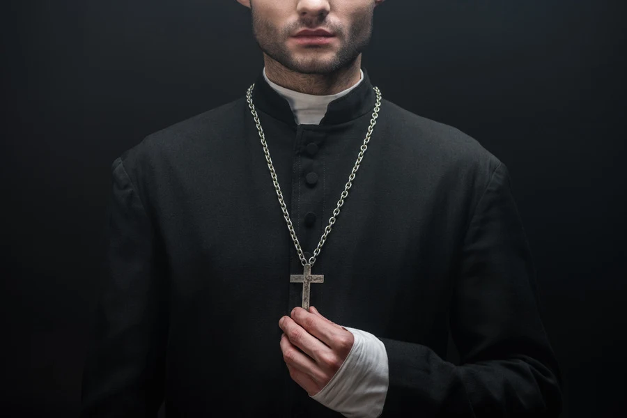 pictures of a priest with a cross