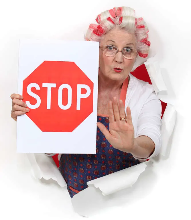 old lady with a stop sign