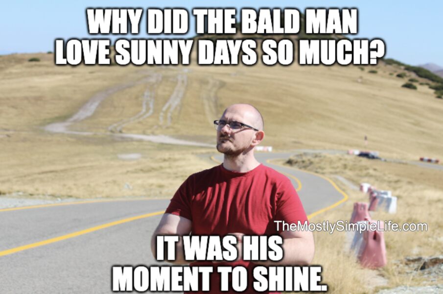 Sunny day, bald man.
