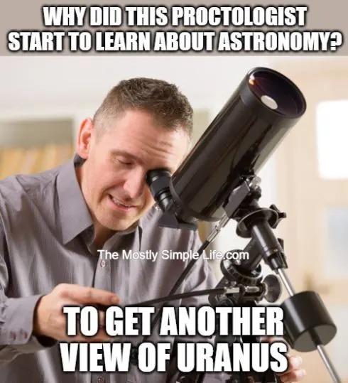 Man looking through telescope.